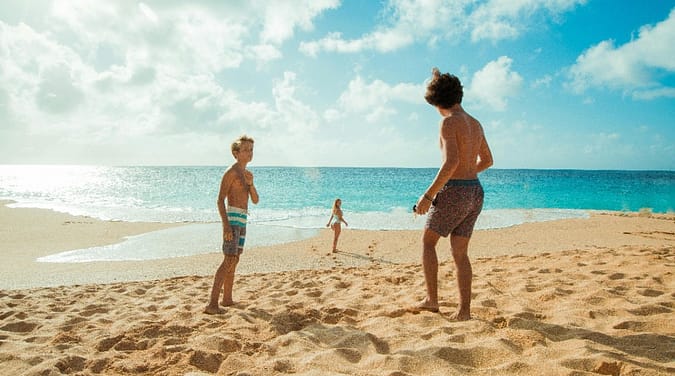 a group of kids on a beach